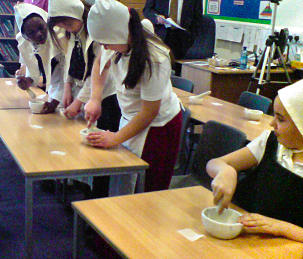 Pupils having fun making remedies.