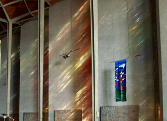 Coloured light projected from the stained glass